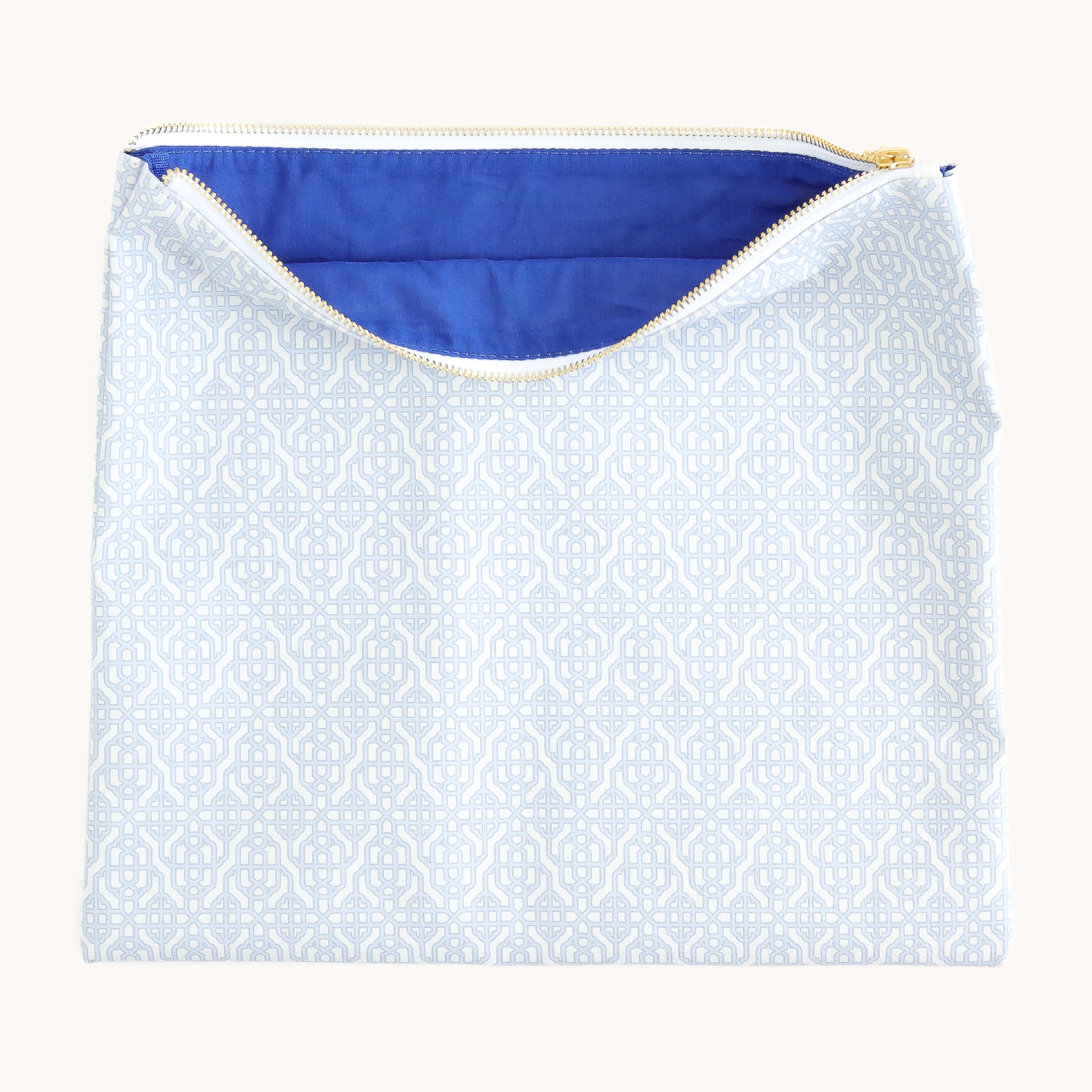 Carolina Trellis pouch unzipped to reveal spacious interior with blue lining for storing planners, pens, and accessories
