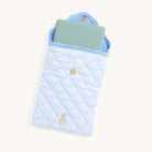 Light blue Blue Pinstripe Quilted E-Reader Case with an e-reader inside with a gold pineapple charm on a white background