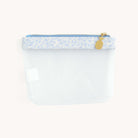 Clear travel pouch with blue floral trim and gold zipper by Simplified by Emily Ley