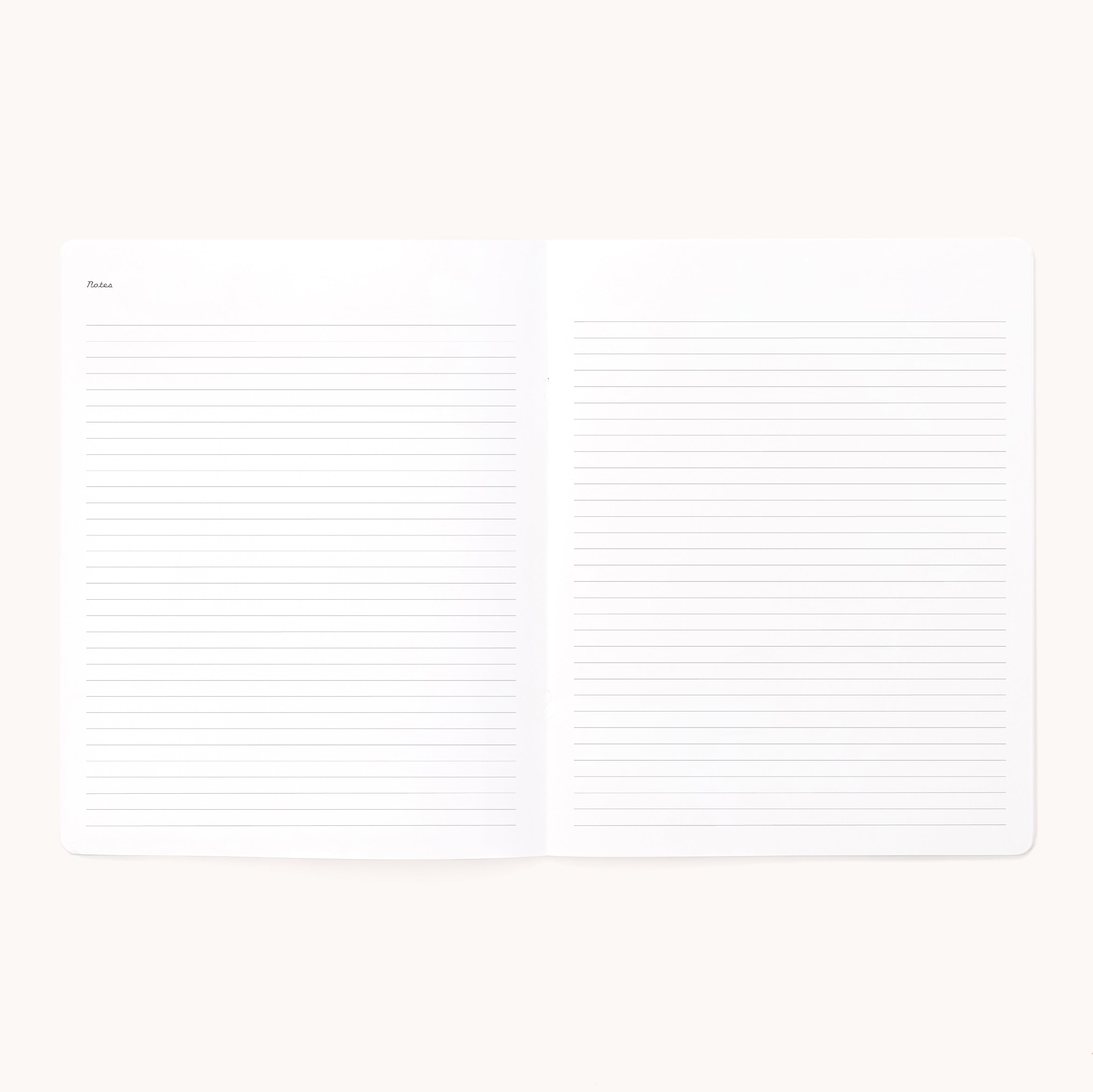 The 2026 Softcover Monthly Simplified Planner - Happy Stripe by Simplified features organized pages that lay flat, perfect for bringing structure and clarity to your planning and notes.