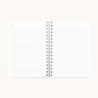 A Simplified 2026 Softcover Weekly Simplified Planner - Happy Stripe lies open and flat, revealing lined pages with Notes at the top left. Set against a plain, light background.