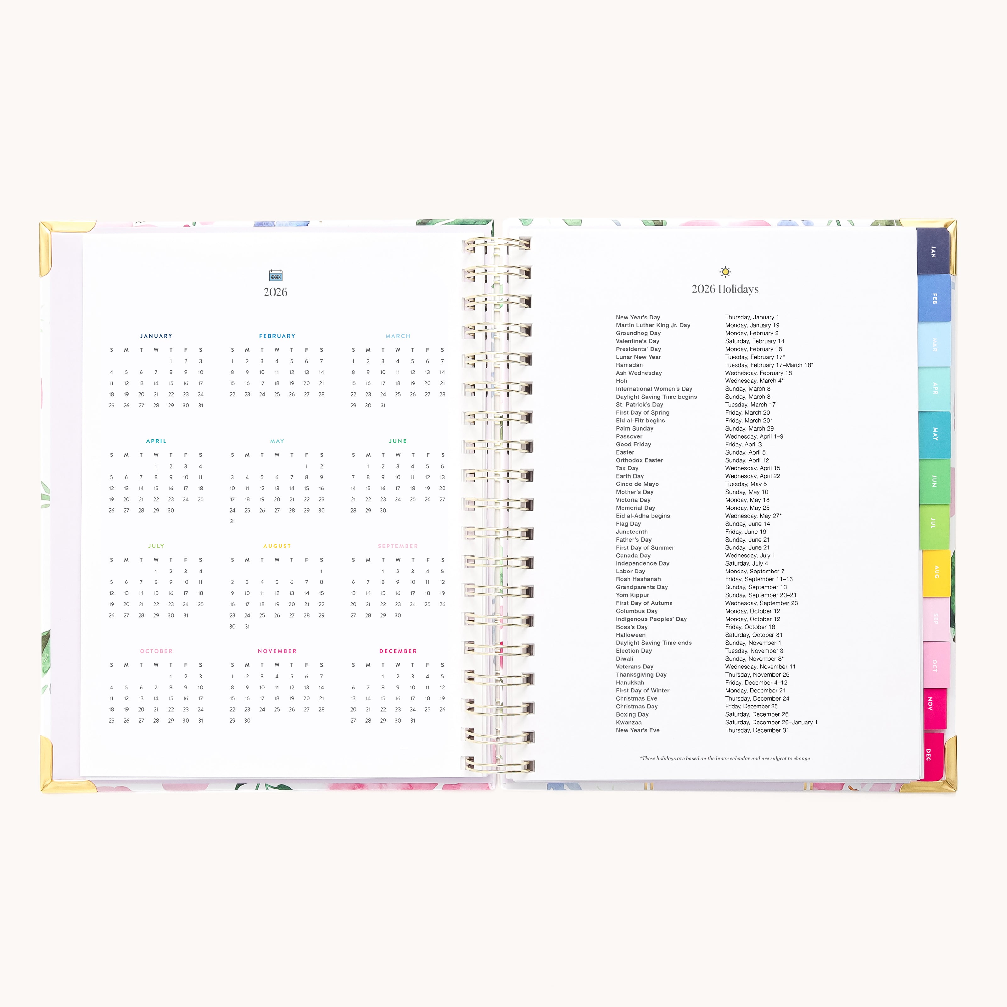 The 2026 Spiral Weekly Simplified Planner - Cottage Floral by Simplified features a year-at-a-glance for 2026 on the left and a 2026 holidays list on the right, highlighted by colorful tab dividers along the edge.