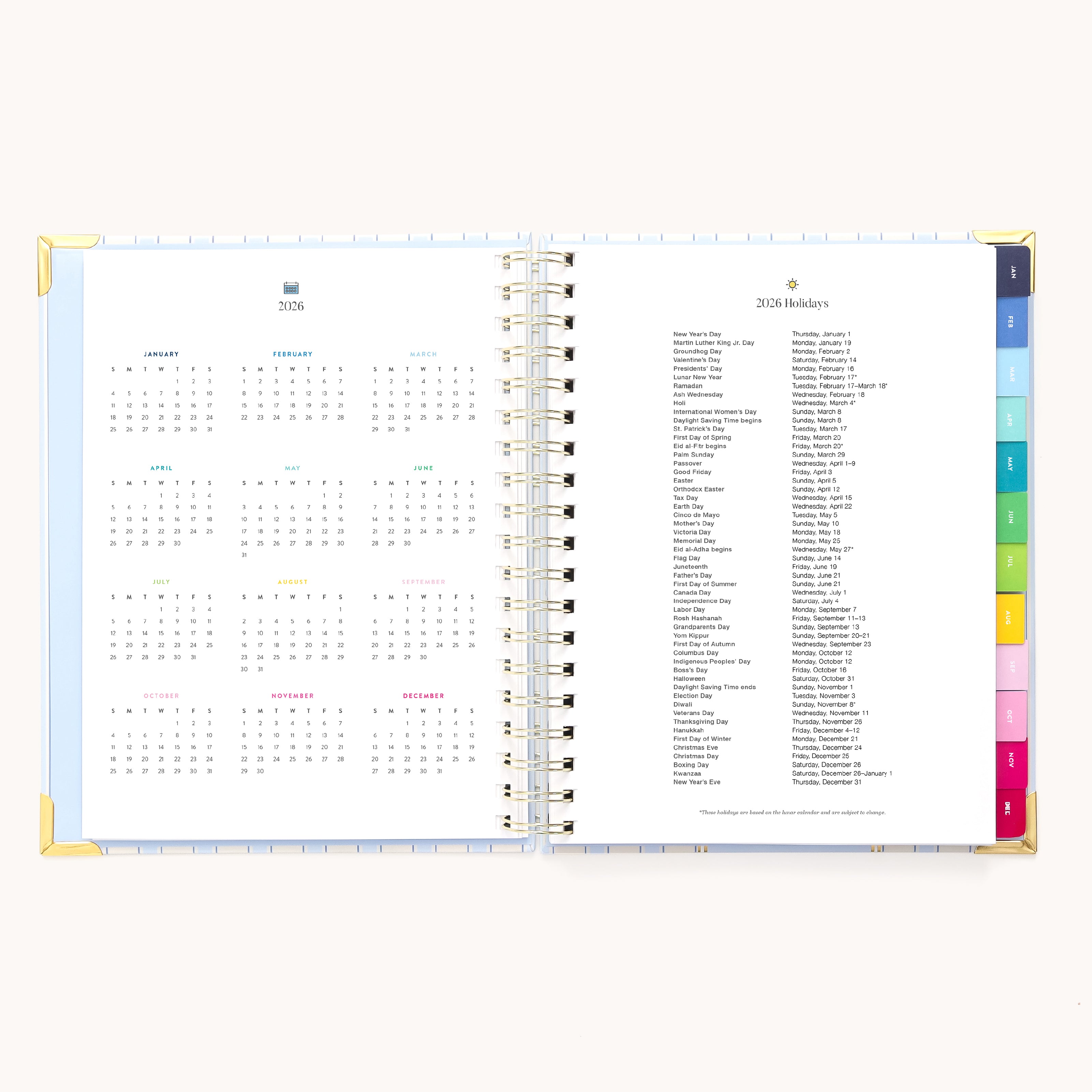 The 2026 Spiral Weekly Simplified Planner - Serene Stripe by Simplified features a yearly calendar on the left and holidays list on the right, with color-coded tab dividers along the edge for easy weekly planning.