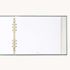 Evergreen Holiday Memories Book open to a blank white page on gold o-rings, ready for photos and holiday cards