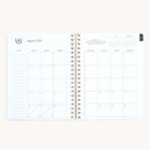 August monthly spread in large softcover weekly planner with clean calendar layout for planning ahead