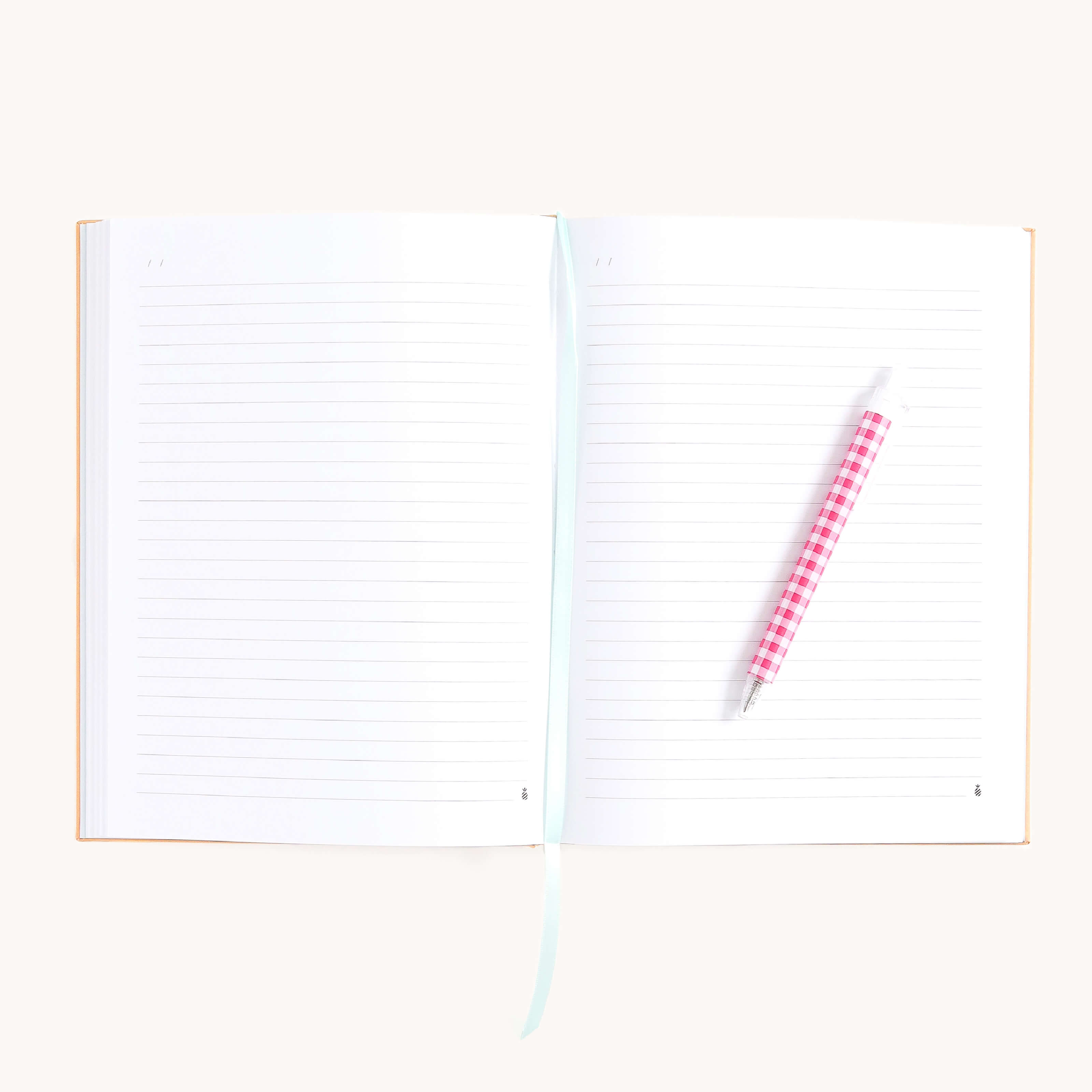 Cheetah Linen Journal open to lined pages with ribbon bookmark and pen, perfect for journaling thoughts, notes, and daily reflections