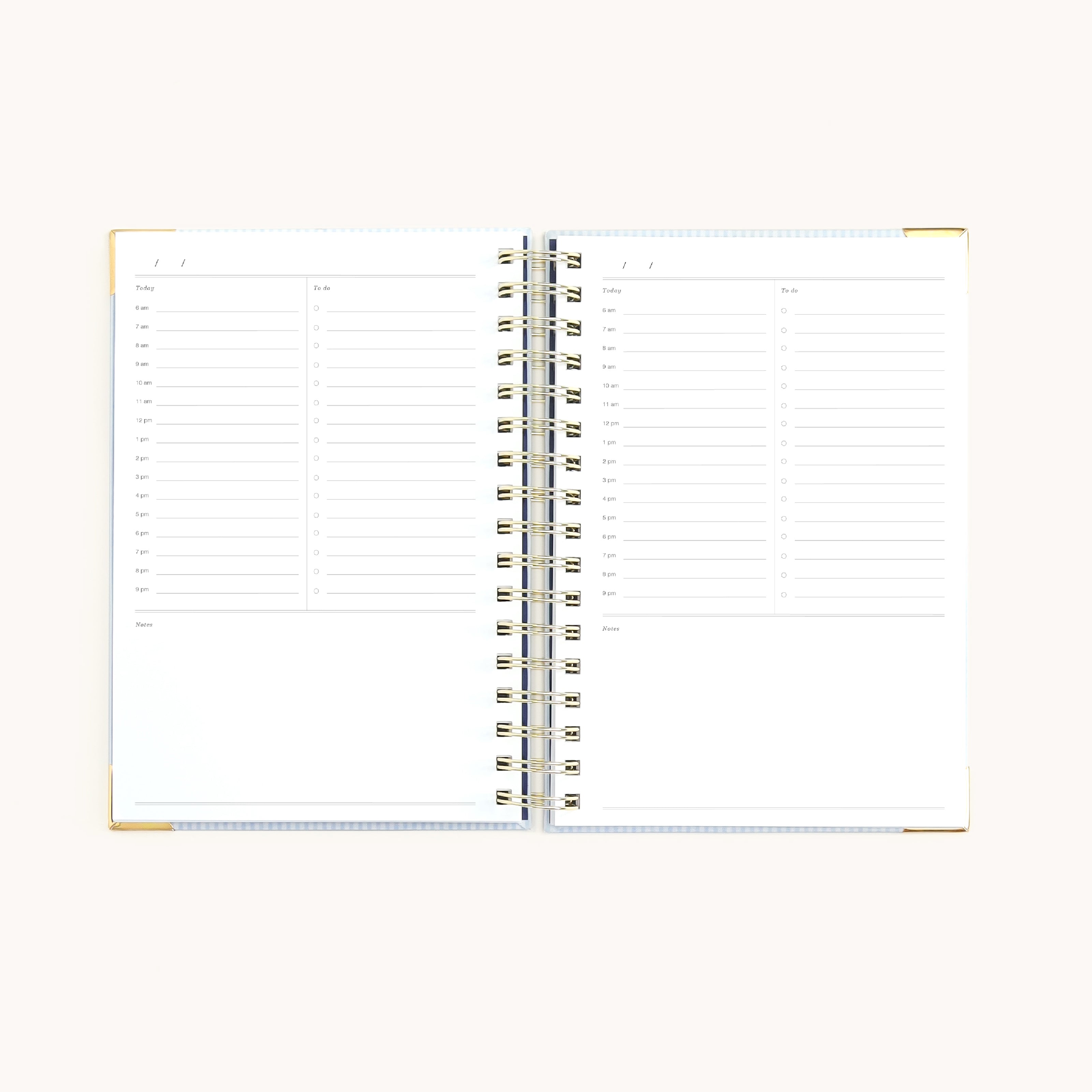 spiral undated daily planner open to hourly daily pages with to-do lists and notes sections for structured, simplified planning