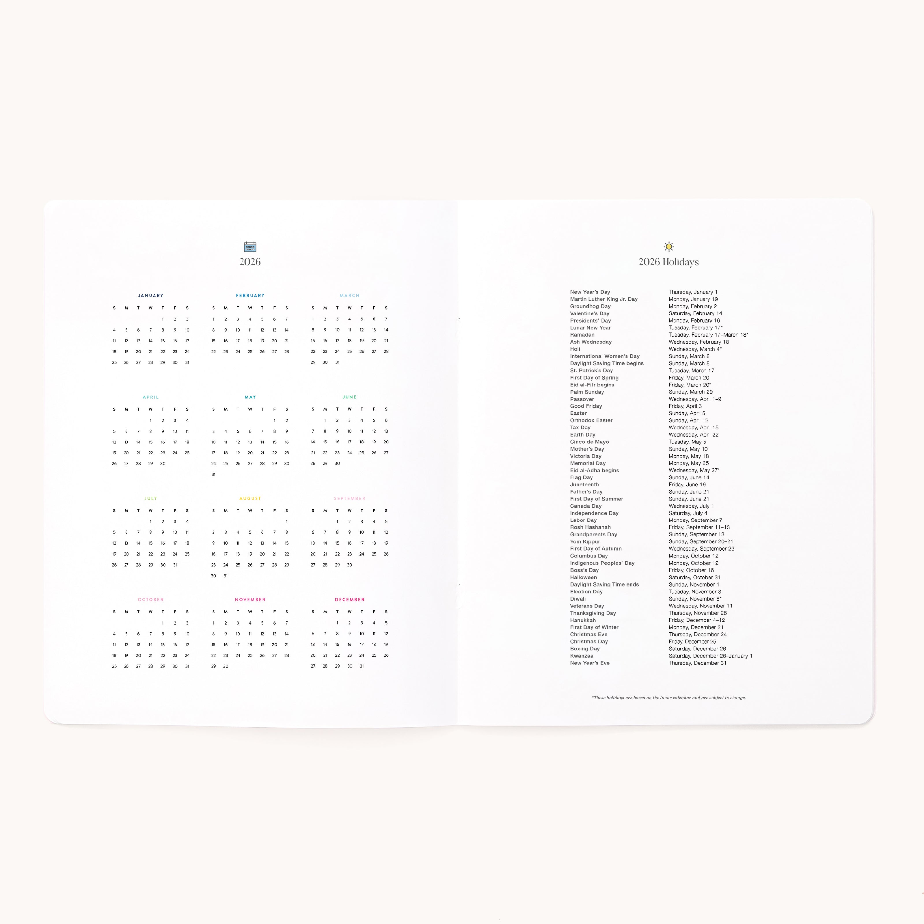 An open 2026 Softcover Monthly Simplified Planner - Happy Stripe by Simplified displays a yearly calendar and holidays in minimal fonts on bright white paper—ideal for streamlined, organized planning.