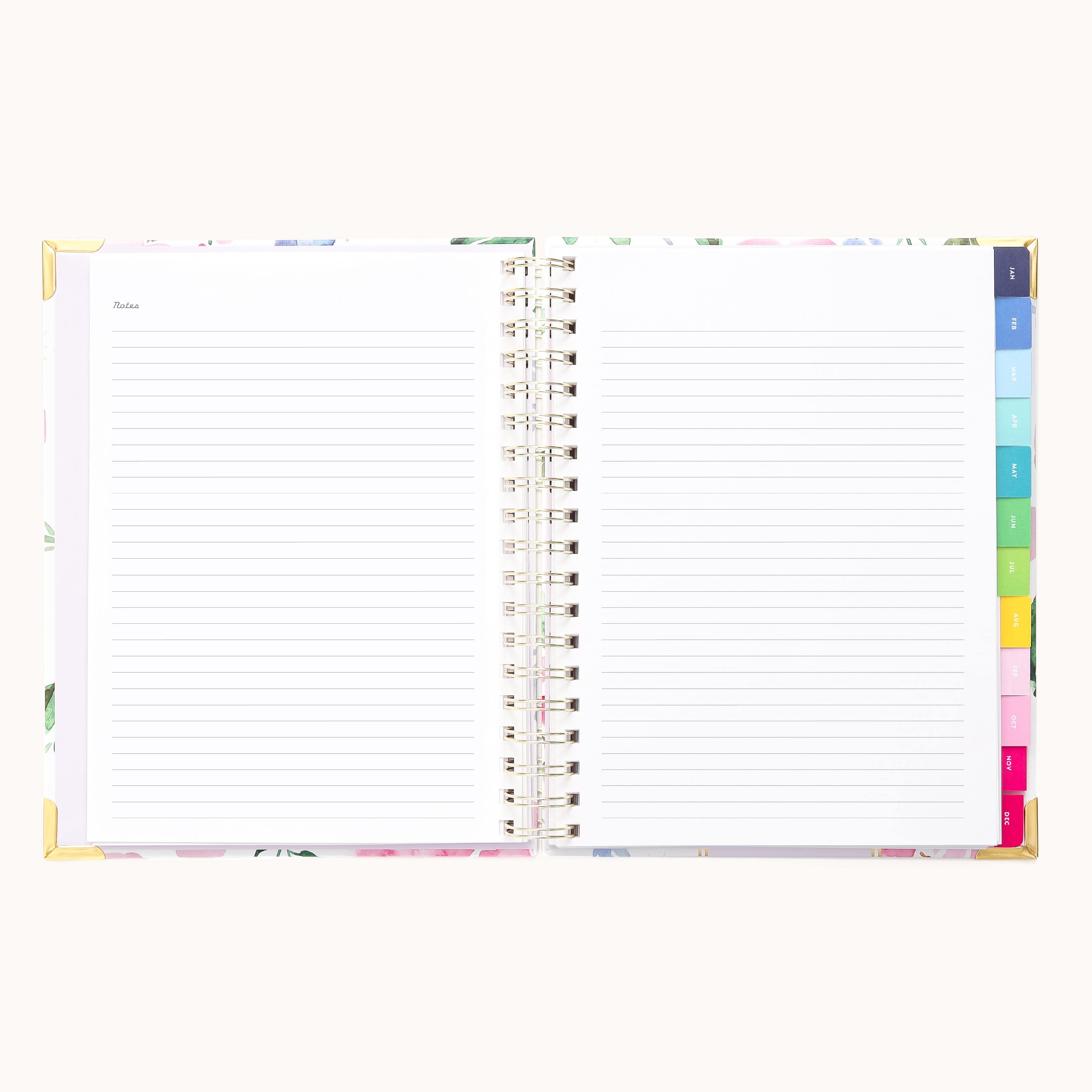 The 2026 Spiral Weekly Simplified Planner - Cottage Floral by Simplified features an open spiral design, lined pages with a Notes heading, colorful tab dividers on the right, and elegant gold corner protectors.