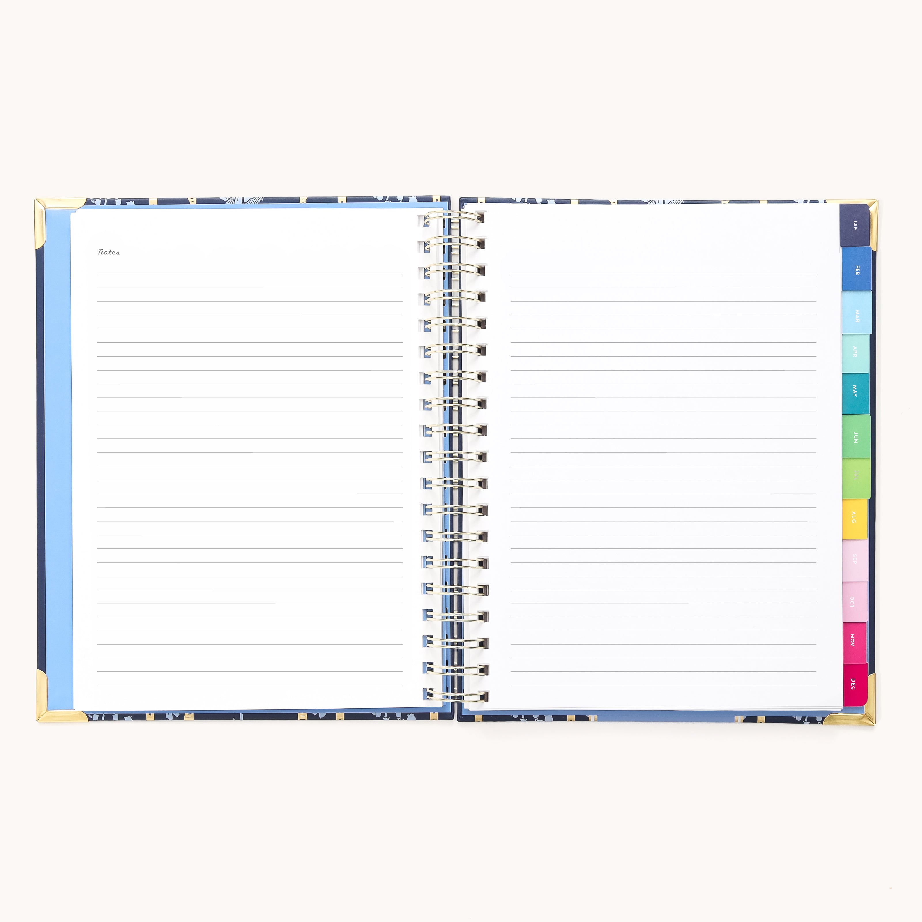 The 2026 Spiral Weekly Simplified Planner - Poppy Posies by Simplified lies open on a light background, displaying lined pages with multicolored tab dividers and a Notes section on the left page.