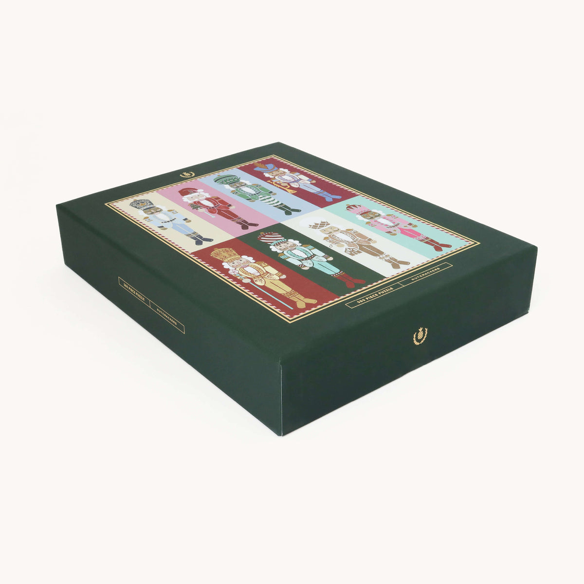 Nutcrackers 500-Piece Jigsaw Puzzle box shown at an angle, dark green with the colorful nutcracker design on the lid