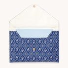 The Simplified Leatherette Tech Case - Block Floral, shown open on a plain background, features a patterned blue envelope style, a white interior flap, a light blue dotted inner pocket, and a button closure.
