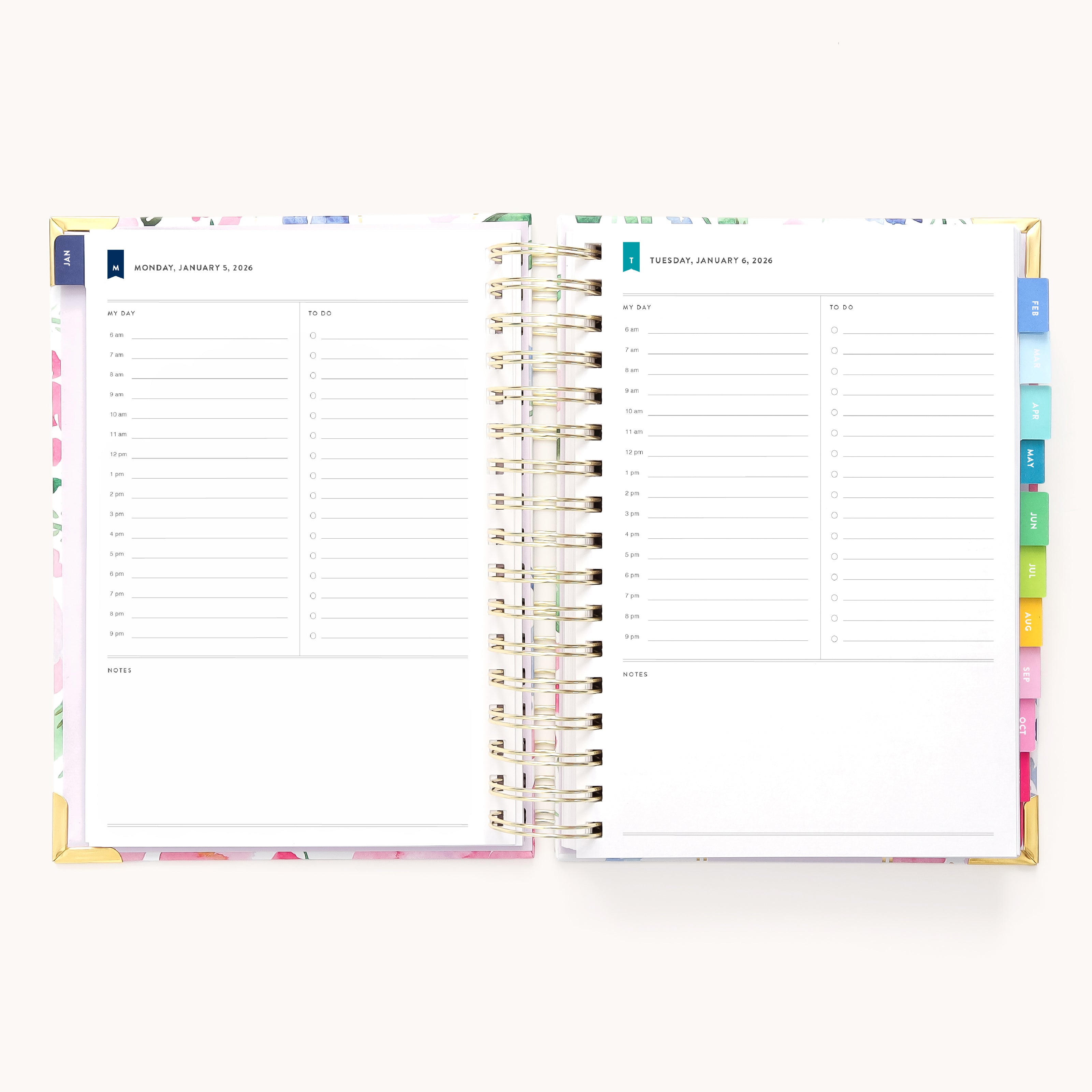 The 2026 Spiral Daily Simplified Planner - Cottage Floral by Simplified is shown open, revealing two daily pages with 6 AM–7 PM time slots, to-do and notes sections, and colorful tab dividers—a perfect planner for organized days.