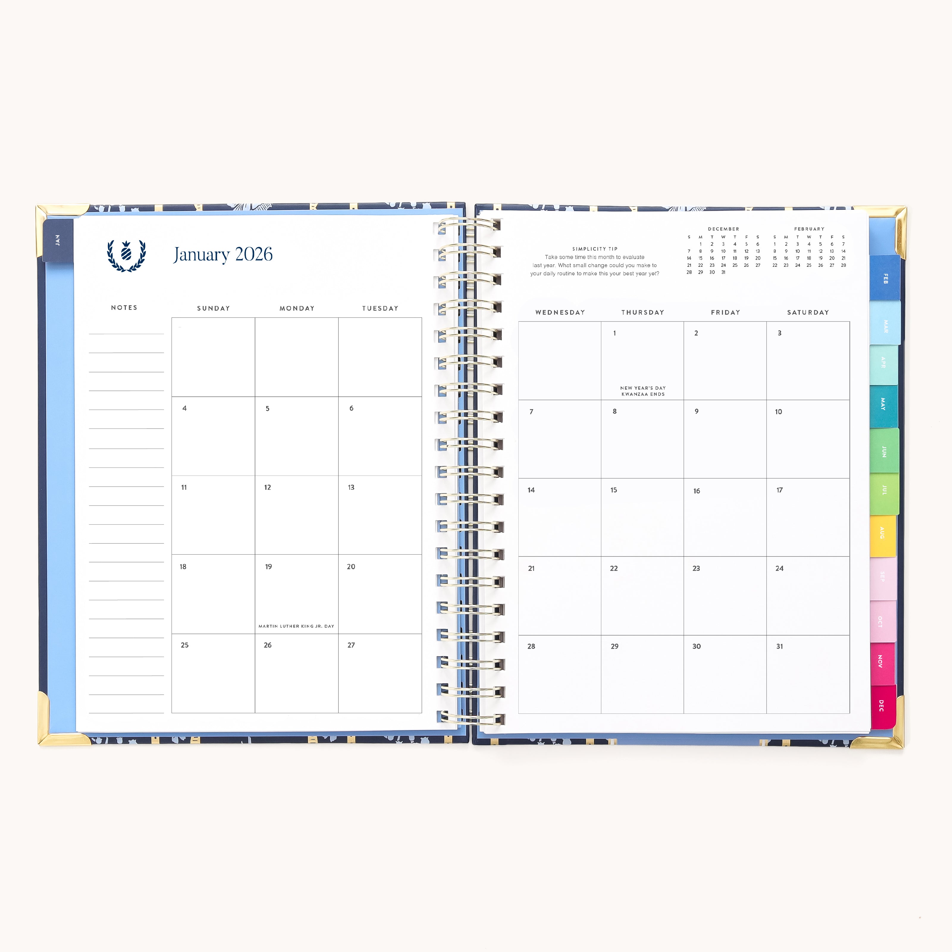 The 2026 Spiral Weekly Simplified Planner - Poppy Posies by Simplified opens to a January 2026 calendar with lined notes on the left, colorful section tabs on the right, and a small yearly calendar in the top right corner.