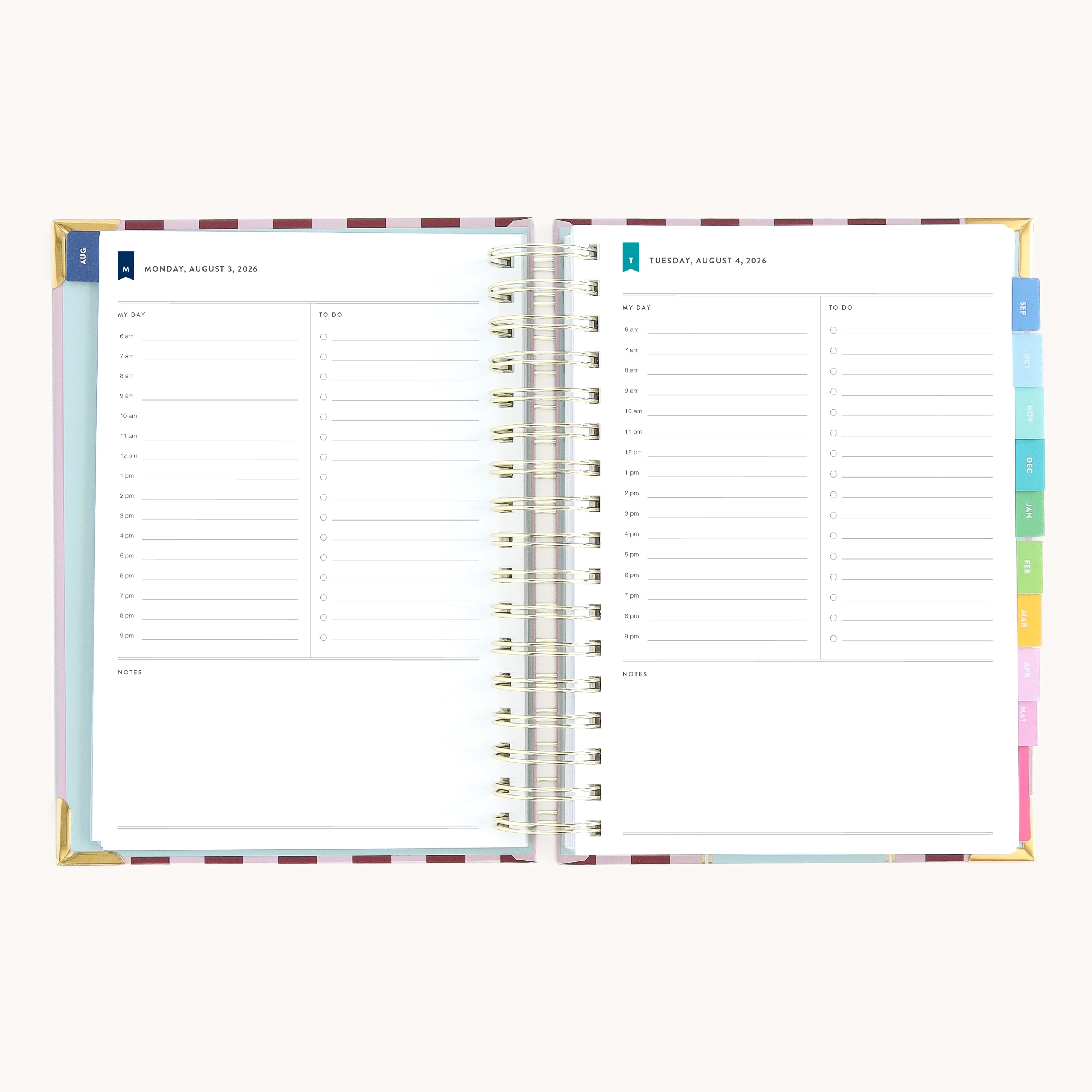 Spiral daily planner open to Monday and Tuesday pages with hourly schedule, to-do lists, and space for notes
