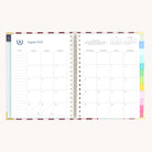 August monthly calendar spread in spiral weekly planner with clean layout for scheduling and goal setting