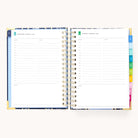 An open 2026 Spiral Daily Simplified Planner - Poppy Posies by Simplified displays hourly slots, blank notes, and colorful dividers—showing Wednesday, January 1, and Thursday, January 2. Ideal for daily planner enthusiasts.