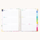 The 2026 Spiral Weekly Simplified Planner – Cottage Floral by Simplified features lined weekly spreads, multicolored tabs along the edge, and gold accents on the cover—an inspiring choice for your year ahead.