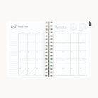 August monthly spread in small softcover weekly planner with clean calendar grid for planning ahead
