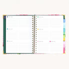 Spiral weekly planner open to weekly layout with space for appointments, to-do lists, and notes