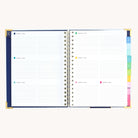 Spiral weekly planner open to weekly layout with space for appointments, to-do lists, and notes