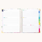 The 2025-2026 Spiral Weekly Simplified Planner by Simplified features lined pages divided into days, with color-coded tabs for different sections. Its Cottage Floral cover includes gold foil details, perfect for your Simplified Prep Work needs.