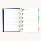 Spiral daily planner open to Wednesday and Thursday pages with structured hourly layout for focused productivity
