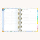 Spiral daily planner open to Wednesday and Thursday pages with structured hourly layout for focused productivity