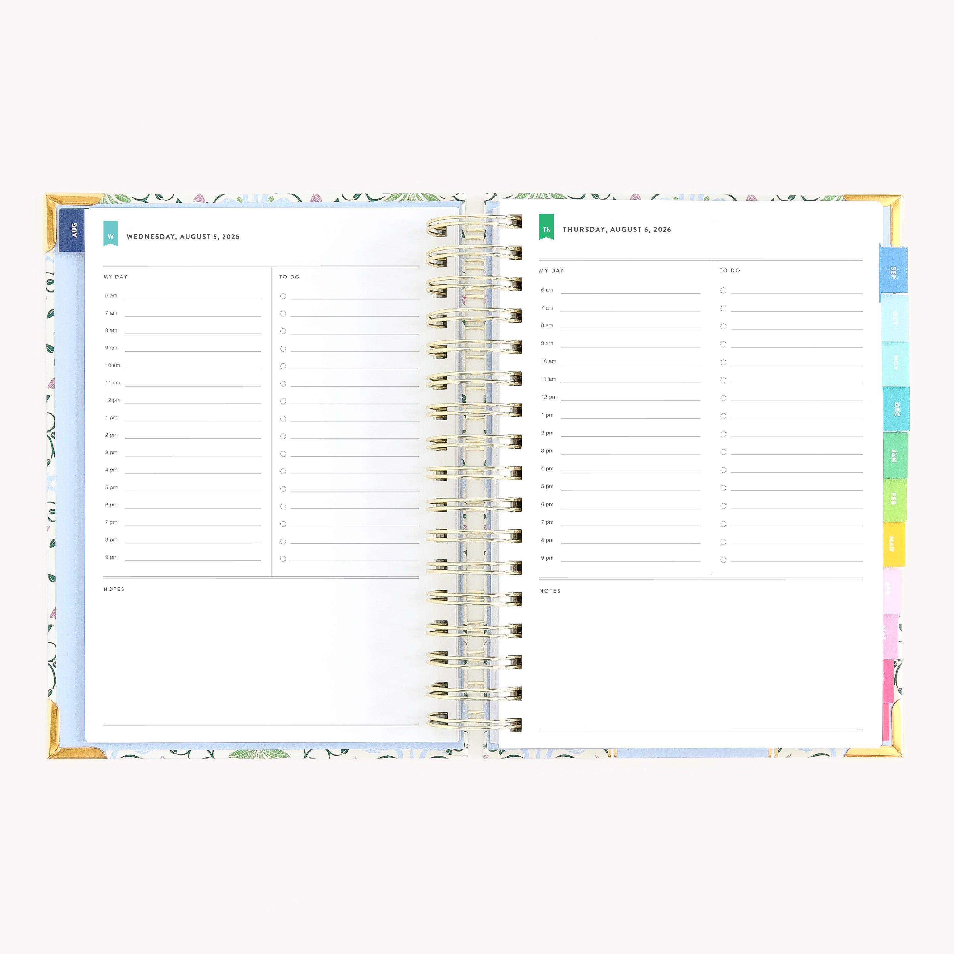 Spiral daily planner open to Wednesday and Thursday pages with structured hourly layout for focused productivity