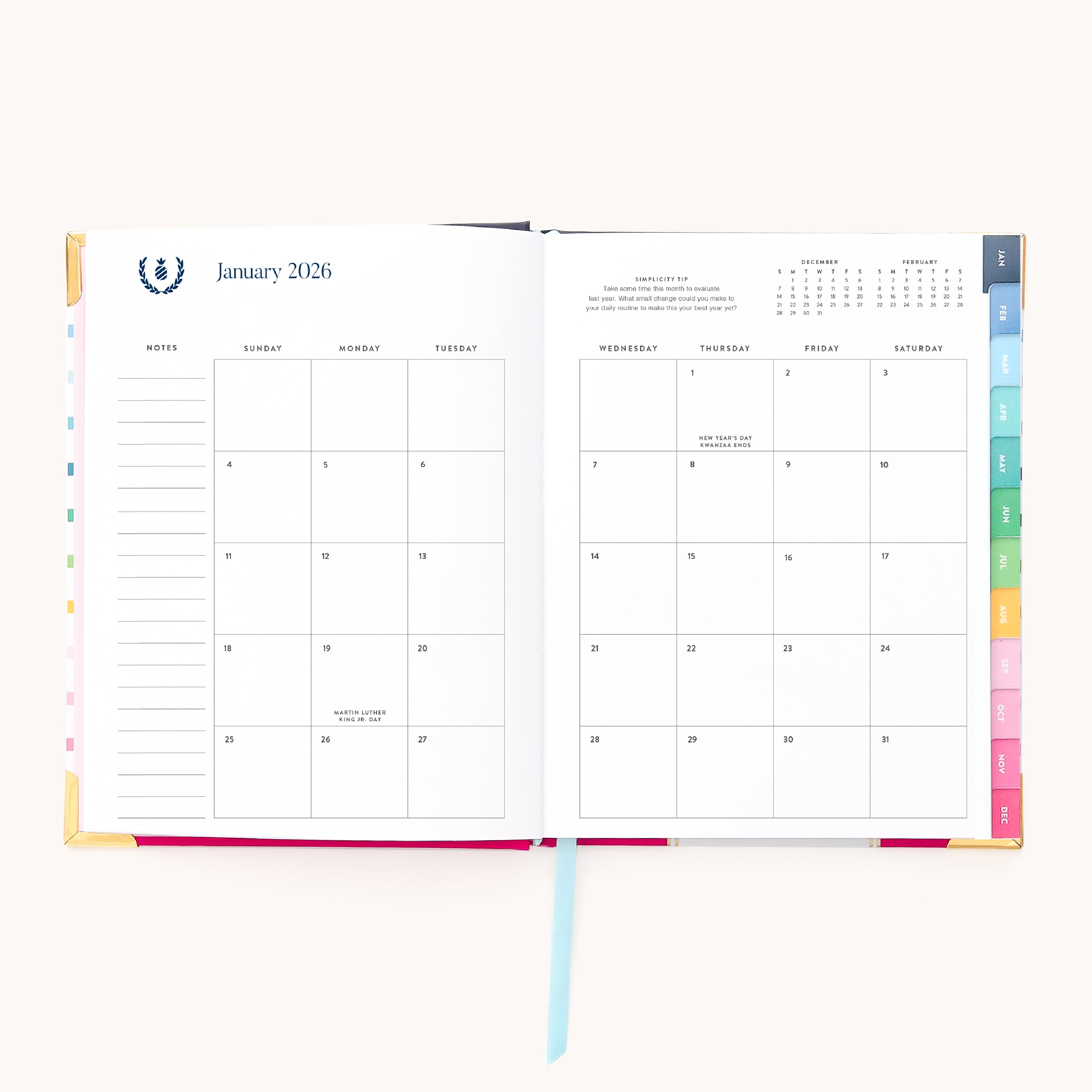 The 2026 Bookbound Weekly Simplified Planner - Happy Stripe by Simplified shows a January monthly spread with colorful tabs, note sections, blank days except for New Year’s Day, and lay-flat binding for easy writing.