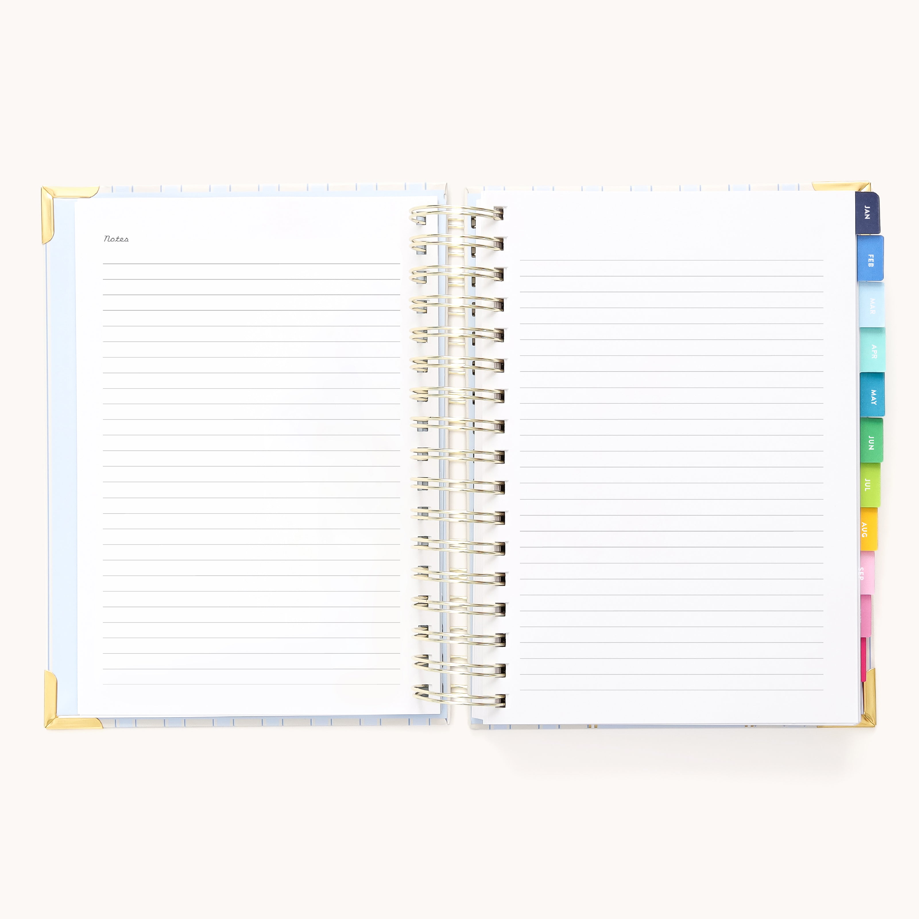 The Simplified 2026 Spiral Daily Simplified Planner - Serene Stripe features lined pages, colorful tab dividers, gold-accented cover corners, and a “Notes” section—ideal for organizing your schedule in style.