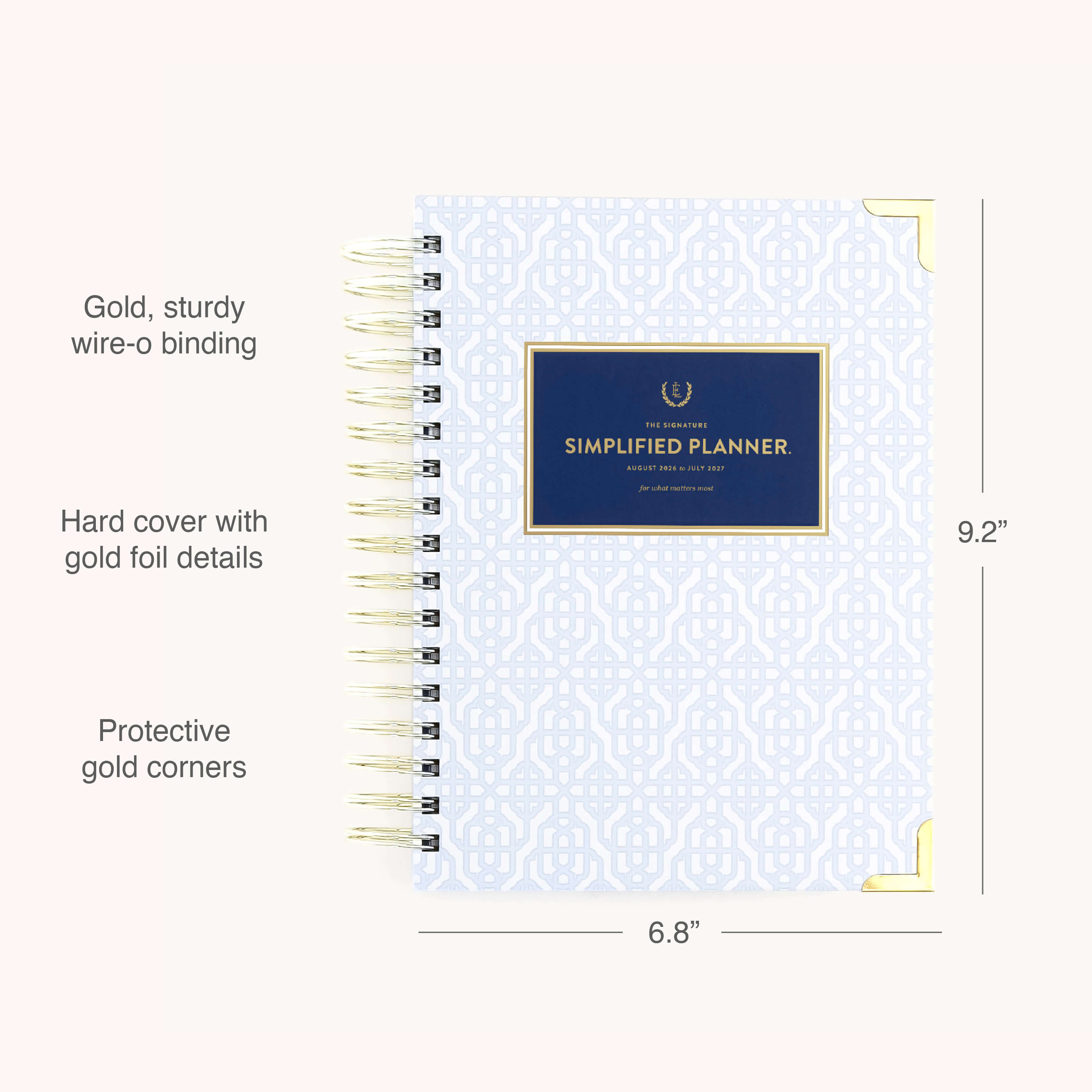 The Simplified 2026-2027 Spiral Daily Simplified Planner – Carolina Trellis features a blue hardcover with gold wire-o binding, gold foil floral accents, and protective corners. Size: 9.2 x 6.8.