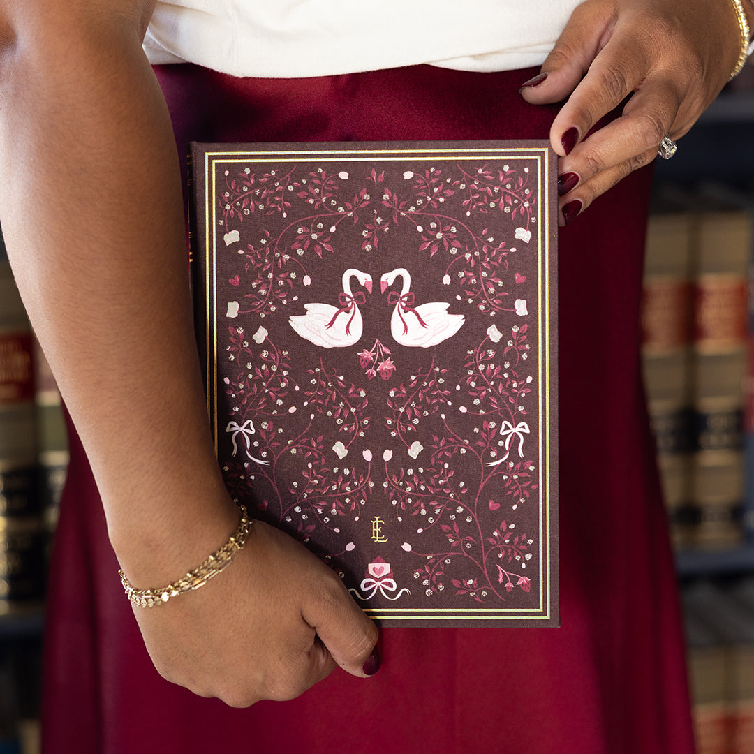 Woman holding Swan Linen Journal