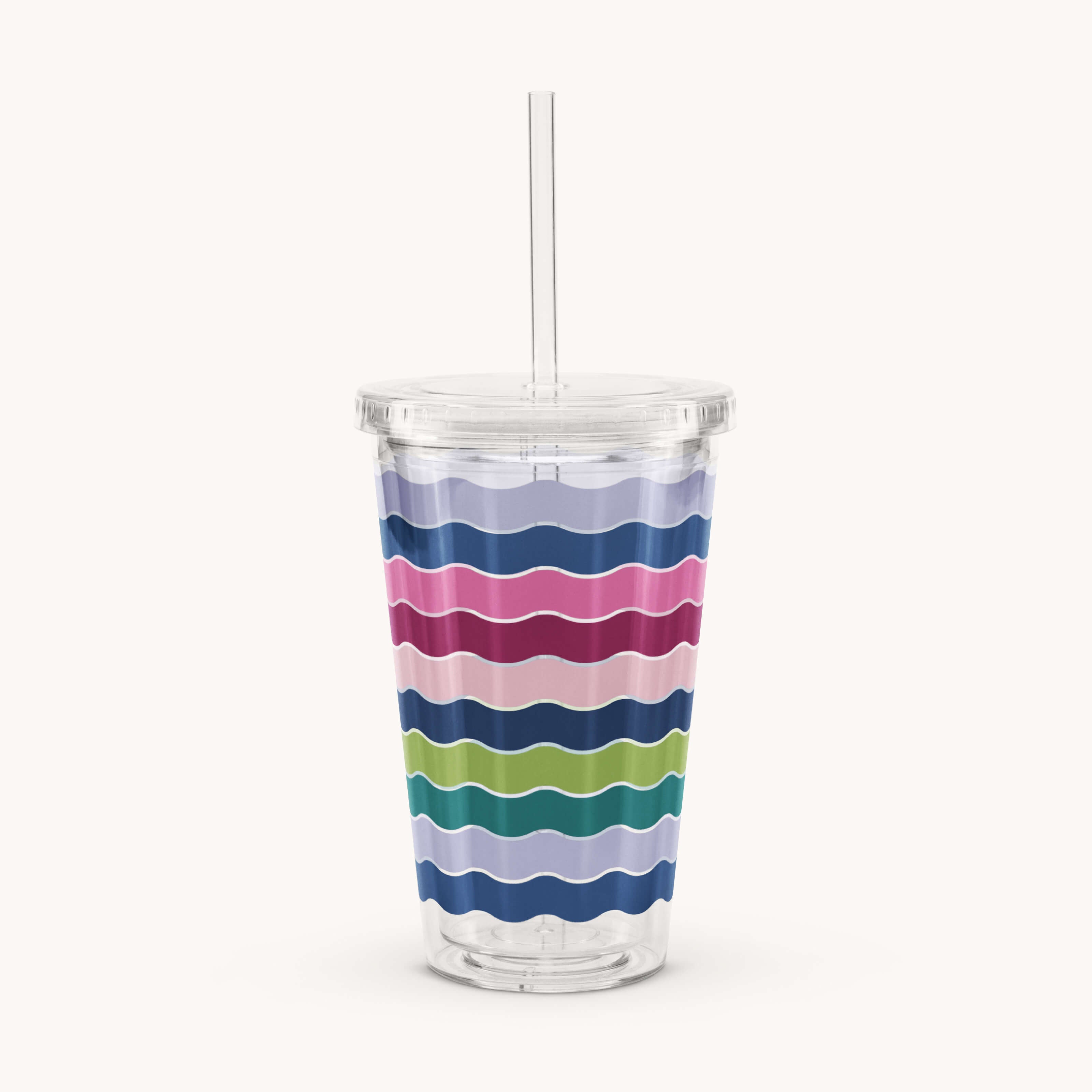 The Simplified Clear Tumbler - Rainbow Row is a reusable cup with a lid and straw, decorated with horizontal wavy stripes in blue, pink, green, and navy.