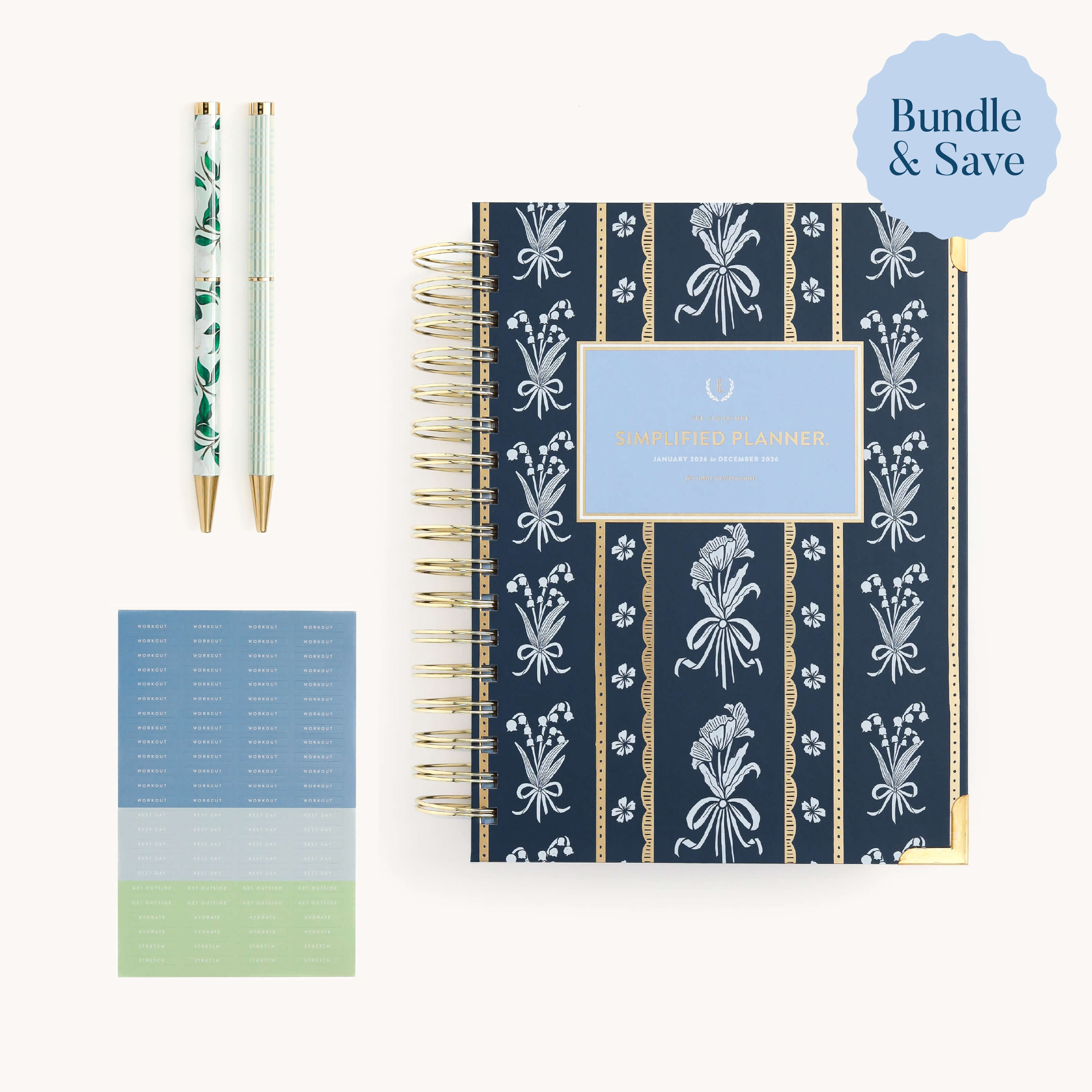 The Daily Simplified Planner Starter Bundle by Simplified® features a navy floral spiral planner, two pens in green and white, pastel labels, and displays a Bundle & Save badge in the top right corner.