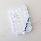 Grocery list written on Misty Meadow lined notepad. 