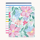 The Simplified® by Emily Ley Pocket Folder Set includes one folder with a Blush Magnolia floral design and another with colorful Happy Stripe pattern.