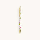 Blush Hydrangea click pen with floral design, gold hardware, and sleek metal body shown on white background