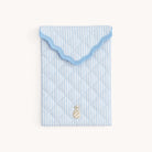 Light blue Blue Pinstripe Quilted E-Reader Case with a gold pineapple charm on a white background