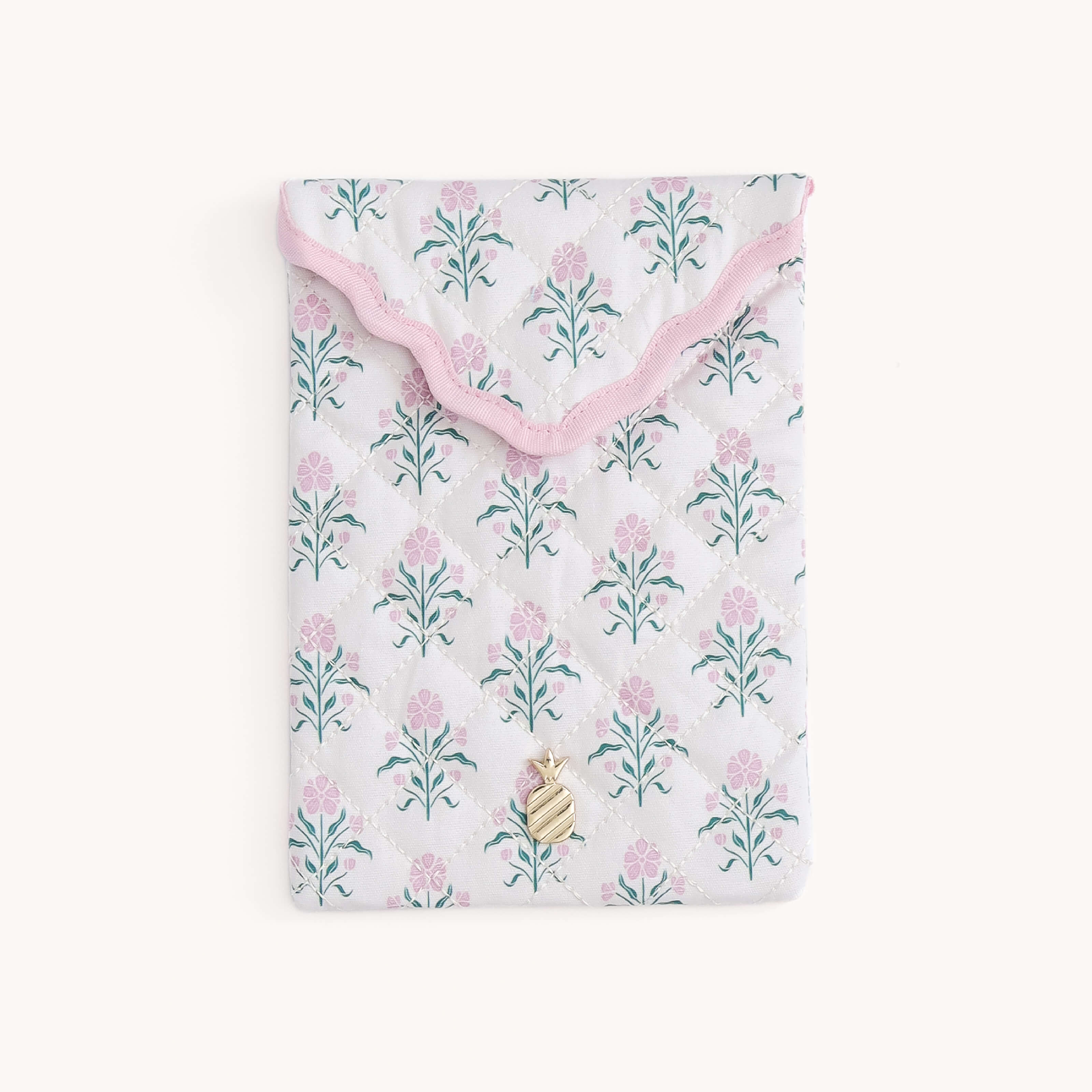 Floral patterned Blush Botanical Quilted E-Reader Case with a gold pineapple charm on a white background