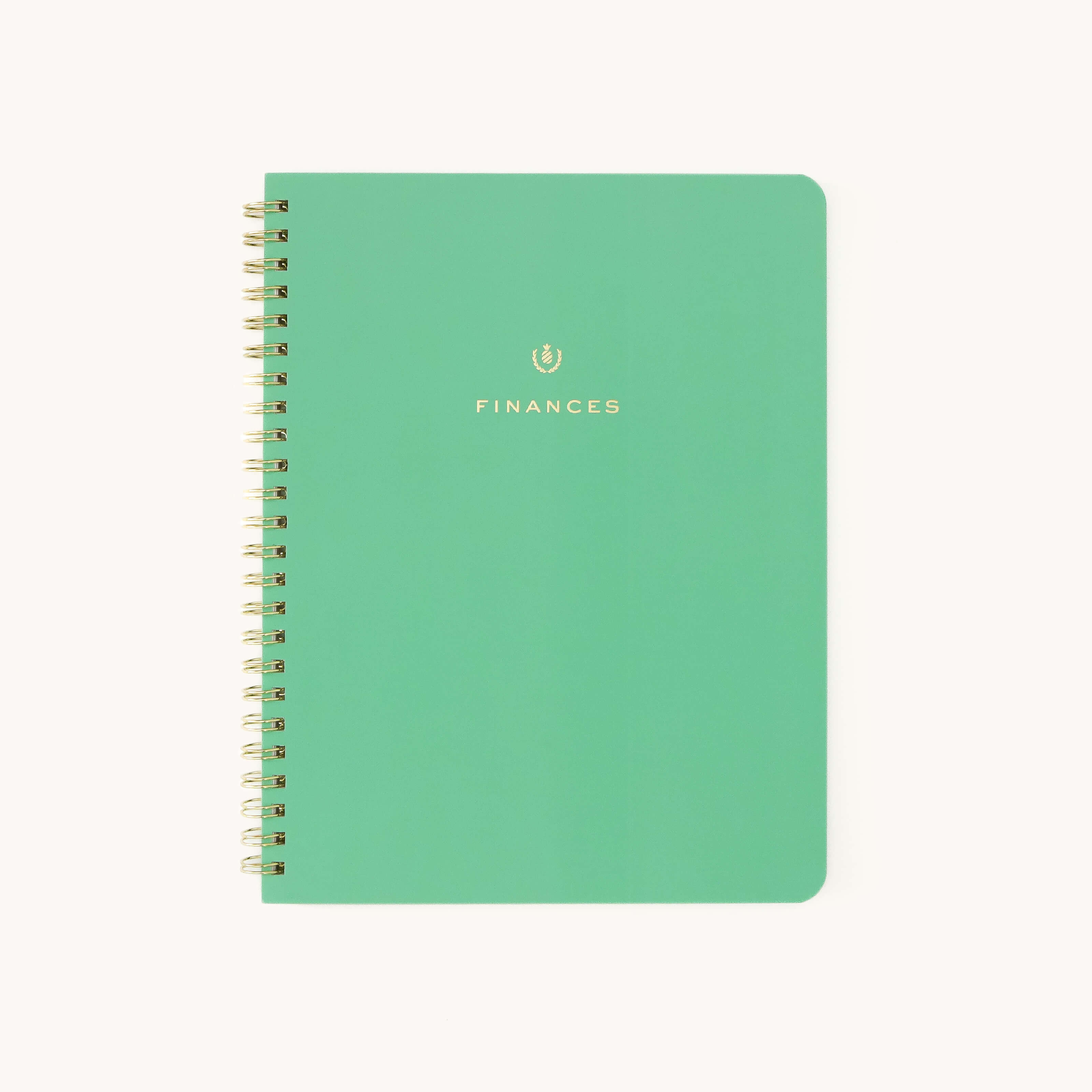 A green spiral-bound Workbook - Finances by Simplified features Finances in gold on the cover. Its perfect for money management, with Simplified printed in small white letters at the bottom to keep your financial goals on track.