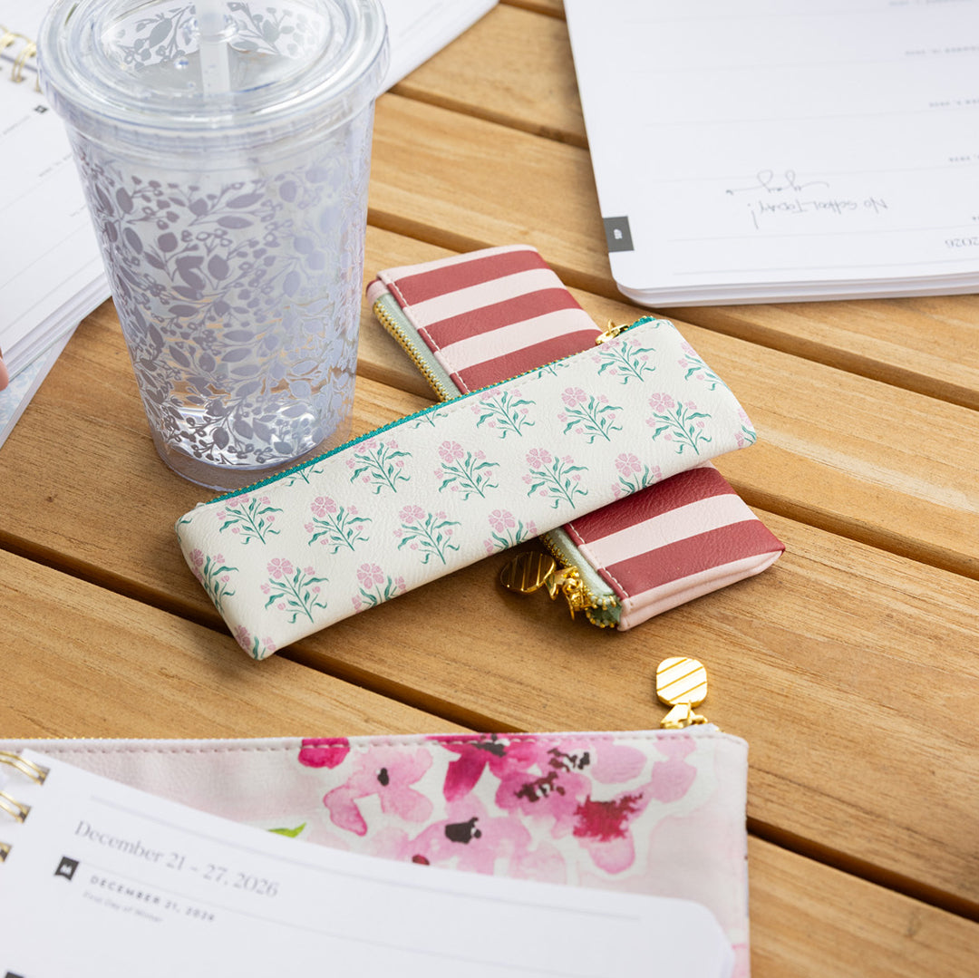 Blush Botanical and Berry Stripe Petite Pen Cases styled on desk 