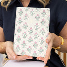 Woman holding Blush Botanical mid size notebook 