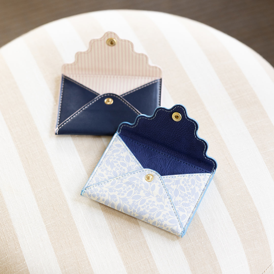 Misty Meadow Leatherette Mini Wallet next to Navy leatherette mini wallet by Simplified by Emily Ley