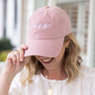 Woman wearing pink cotton Out Of Office baseball cap by Simplified by Emily Ley