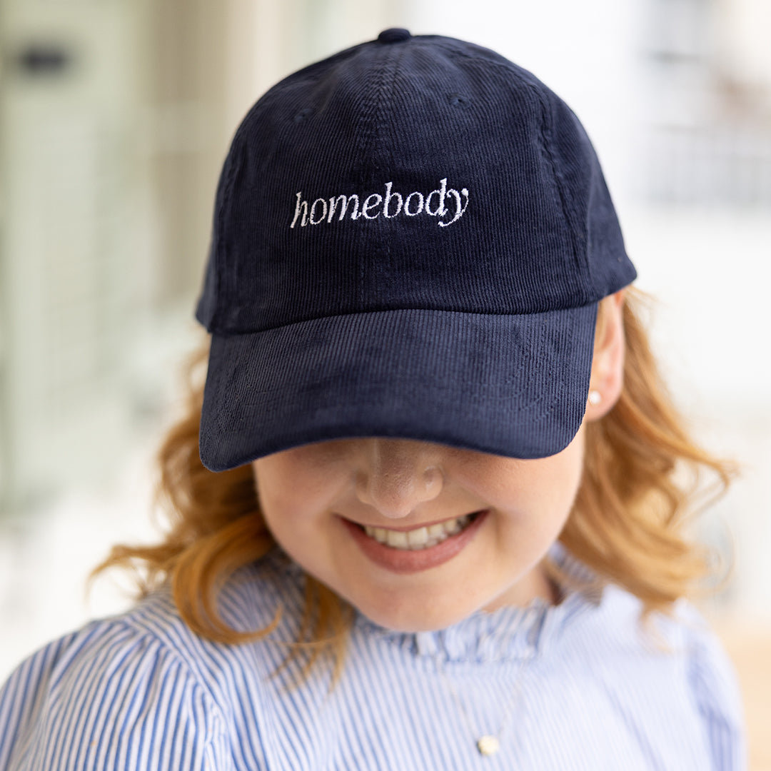 Woman wearing navy corduroy Homebody baseball cap by Simplified by Emily Ley