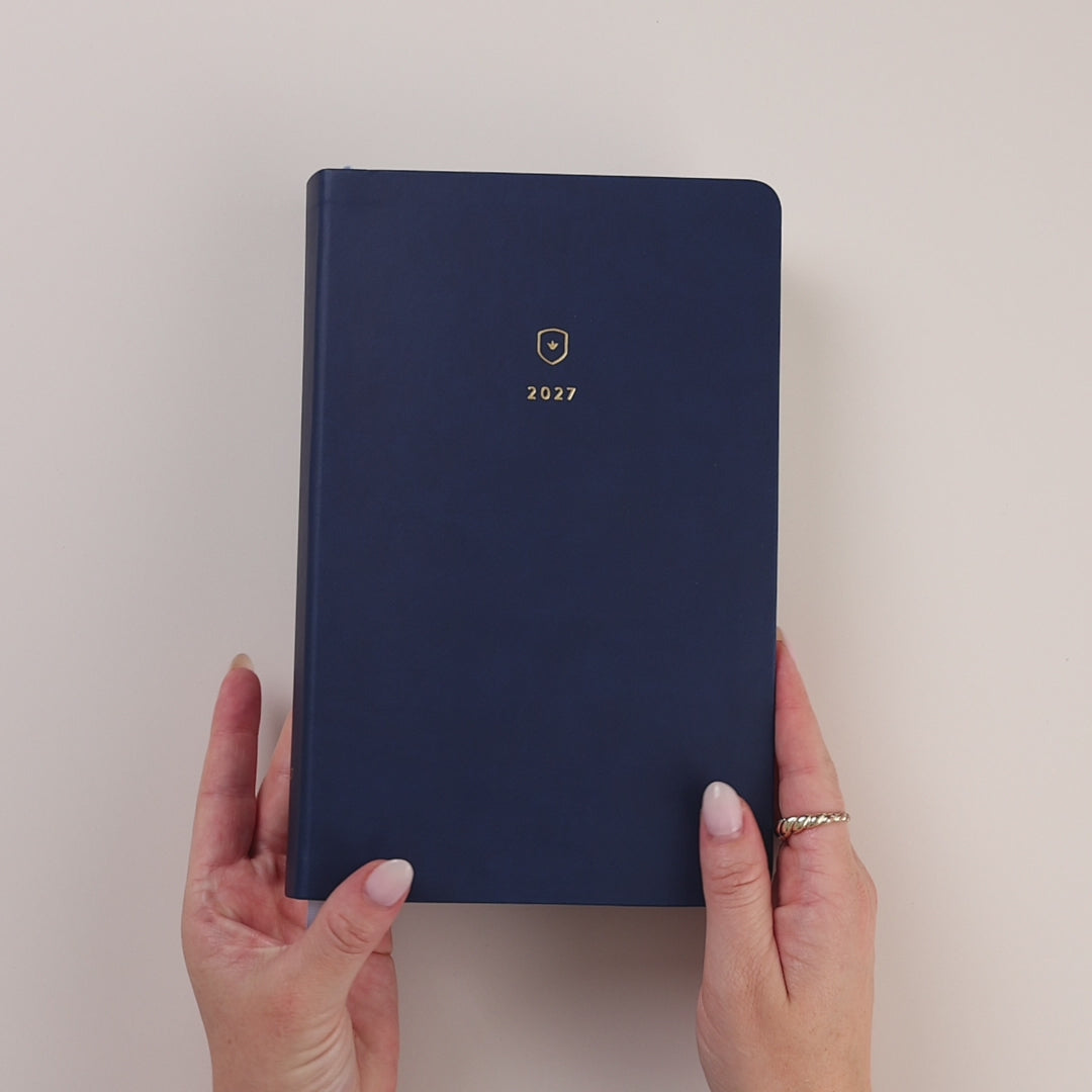 Video of the Navy Bookbound Daily Dapperdesk Planner being held and opened