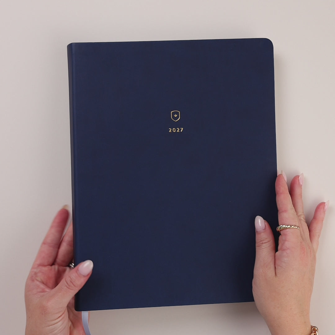 Video of the Navy Bookbound Weekly Dapperdesk Planner being held and opened